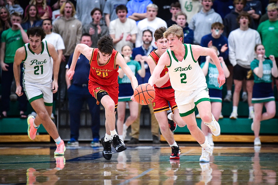 Glacier's Liam Ells (2) picks up a steal in the first half against Missoula Hellgate at Glacier High School on Tuesday, Feb. 20. (Casey Kreider/Daily Inter Lake)