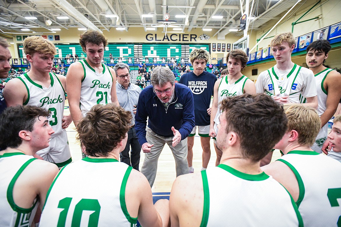 Glacier head coach Mark Harkins talks to the Wolfpack before the start of the third quarter against Missoula Hellgate at Glacier High School on Tuesday, Feb. 20. (Casey Kreider/Daily Inter Lake)
