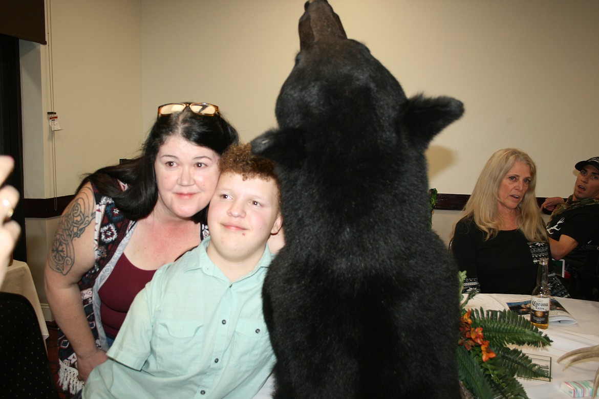 Cyrus Levine (right) and his mom Teagan Levine (left) pose with Cyrus’ trophy during the 2022 Youth Outdoors Unlimited Moses Lake banquet.