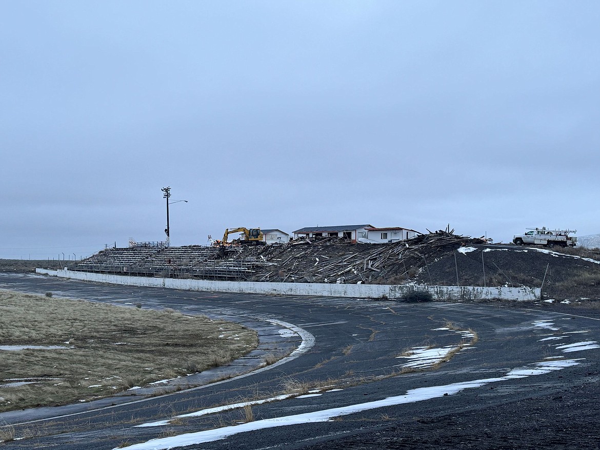 The old Ephrata Raceway grandstands come down at the site of the new Grant County Jail.