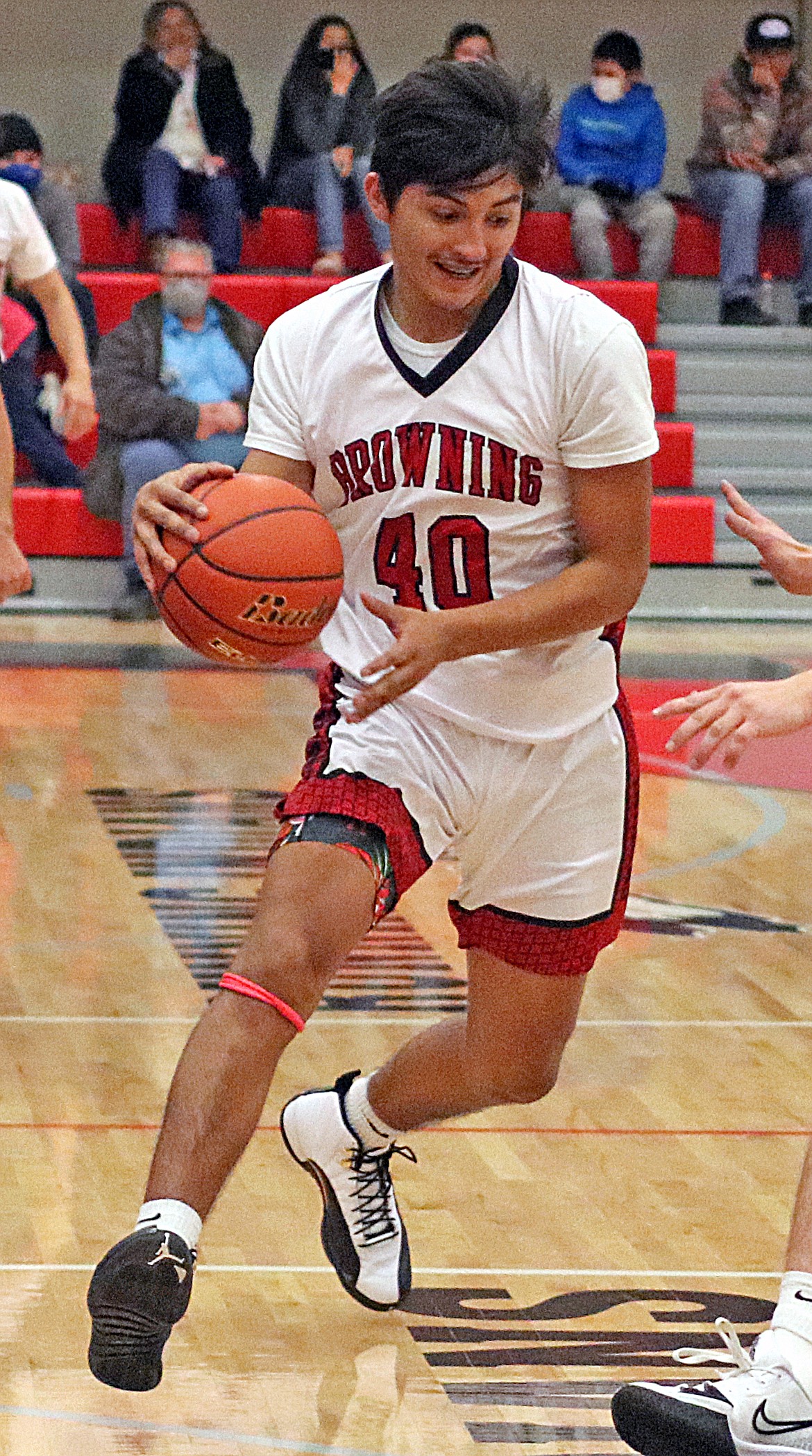 TOMMY RUNNING RABBIT is averaging 11.9 points and 6.5 rebounds for the 14-4 Browning Indians boys basketball team. (John McGill/Glacier Reporter)