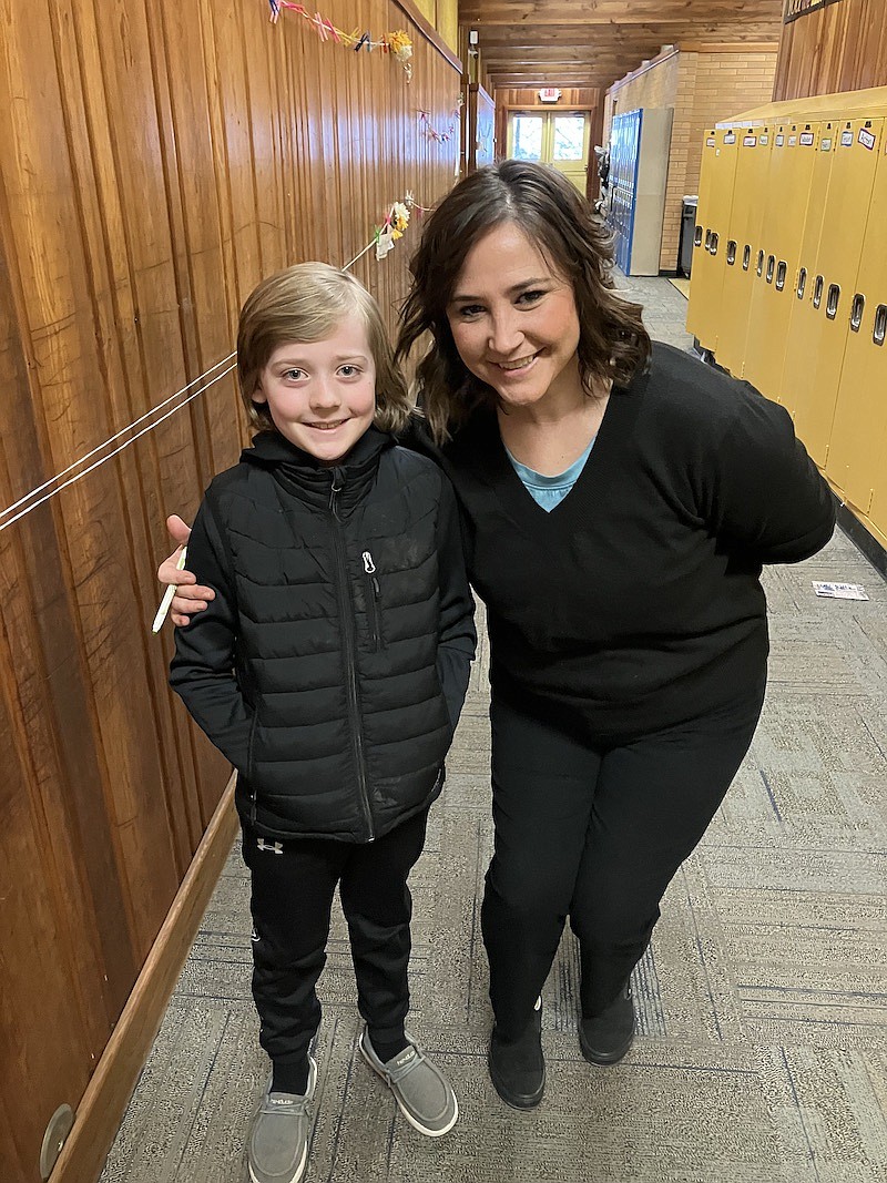 Libby Elementary School fourth-grade student Samson Skranak and his teacher, Mrs. Sherbo, celebrate his win in the recent spelling bee. (Photo courtesy Brittany Katzer)