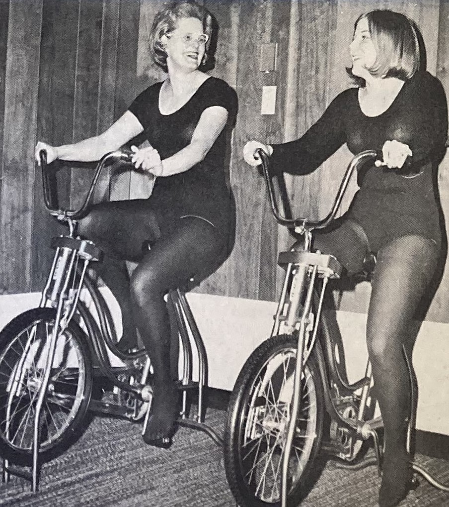 EvaMae Kline and her daughter, Midge (Kline) Smock, ride exercise bikes at the Krystal Plunge.