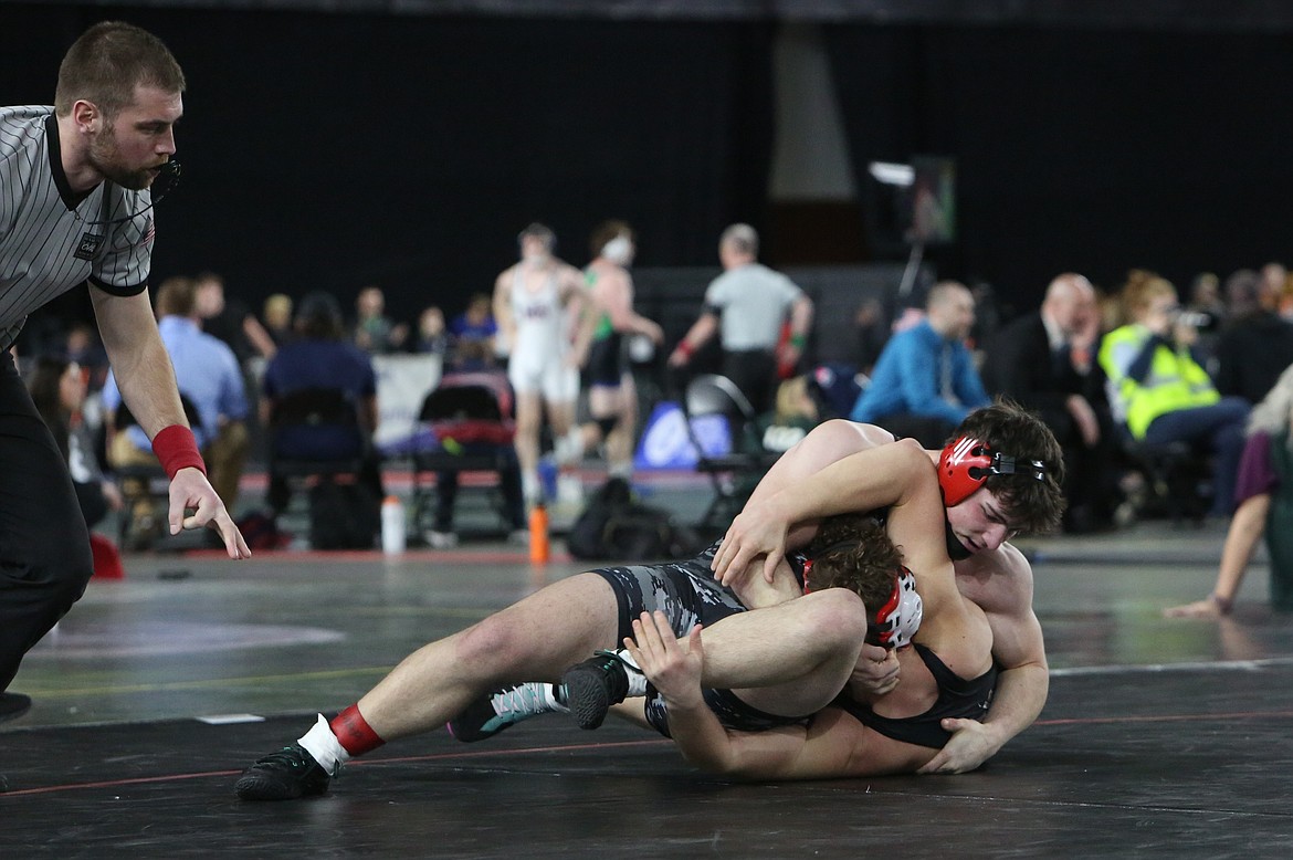 Lind-Ritzville/Sprague senior Gabe Smith, top right, earns three points for a near fall in the 1B/2B 215-pound finals.