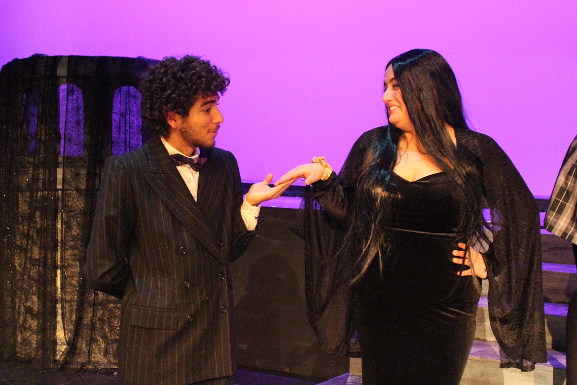 Gomez and Morticia Addams (Alexis Birrueta Ramos and Alicia Lasley Pineda) sometimes have a stormy relationship, despite appearances. The Quincy High School production of “The Addams Family” opens March 1.