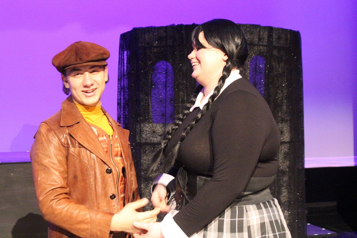 Lucas Bieneke (Carter Yeates), left, and Wednesday Addams (Emma Galloway) have an ulterior motive for bringing their families together.