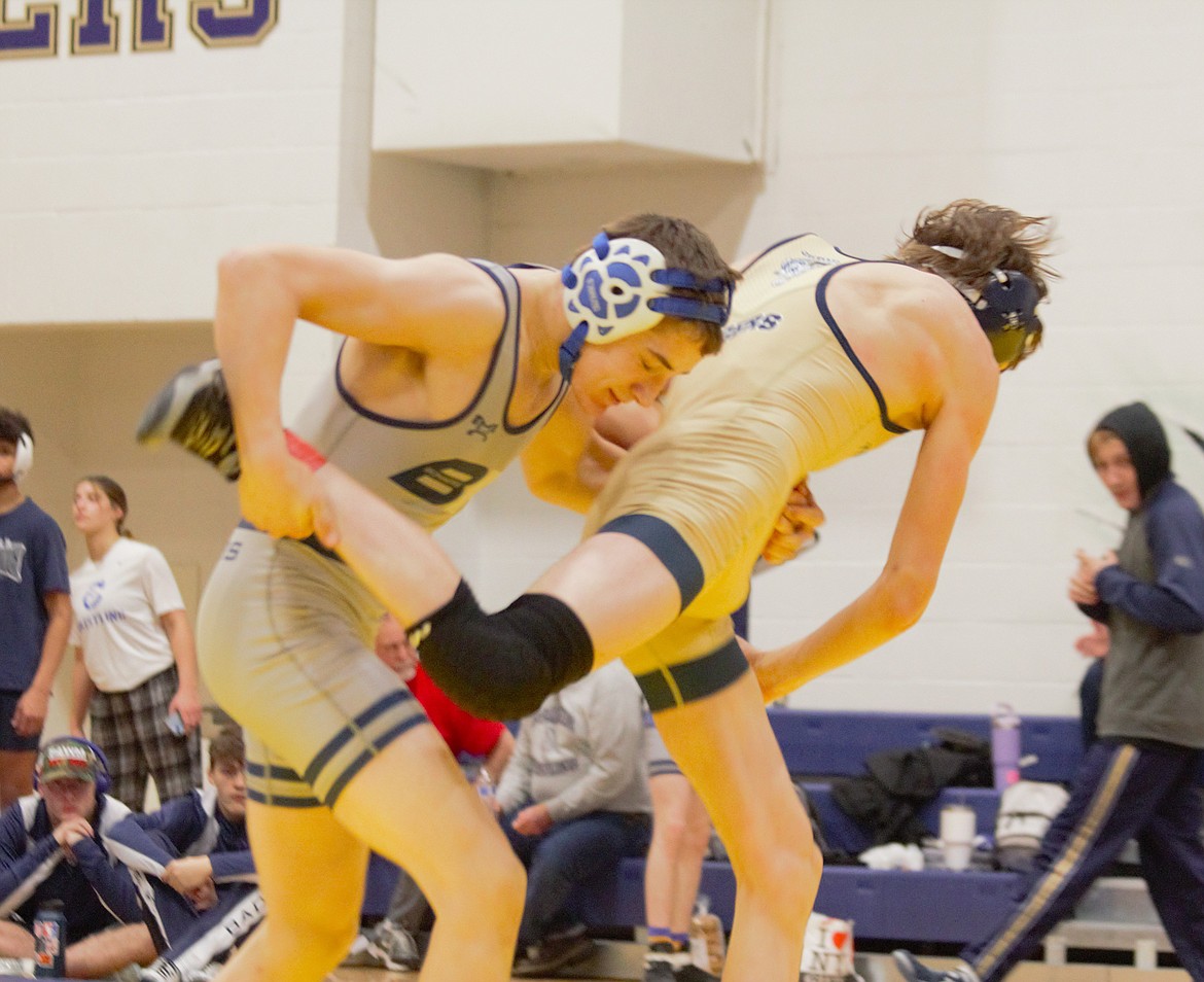 Saber Blackmore goes for a takedown in the championship round of districts.