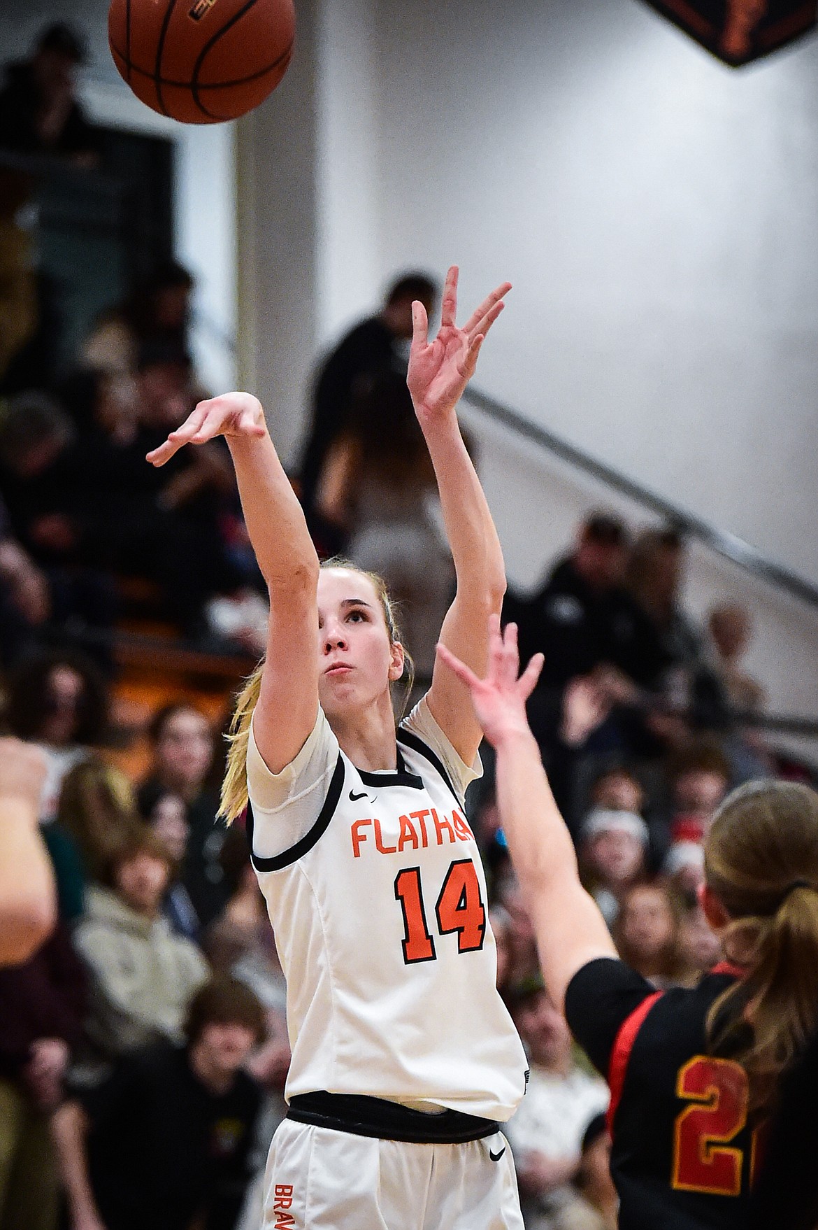 Flathead's Kennedy Moore (14) knocks down a three in the first half against Missoula Hellgate at Flathead High School on Thursday, Feb. 22. (Casey Kreider/Daily Inter Lake)