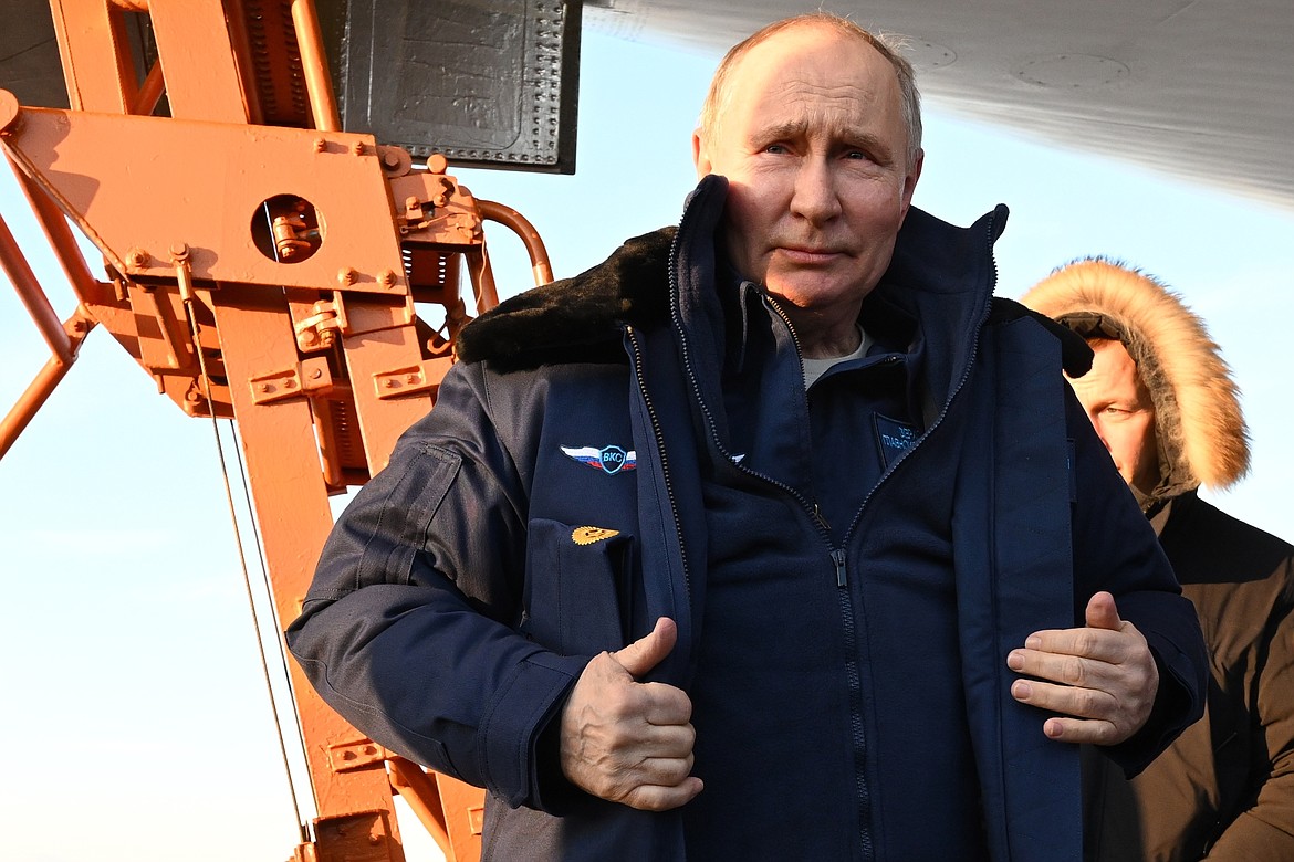 Russian President Vladimir Putin gets off a Tu-160M strategic bomber after a flight in Kazan, Russia, Thursday, Feb. 22, 2024. (Dmitry Azarov, Sputnik, Kremlin Pool Photo via AP)