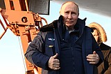 Putin takes a flight in nuclear-capable bomber in a tough message to the West ahead of election
