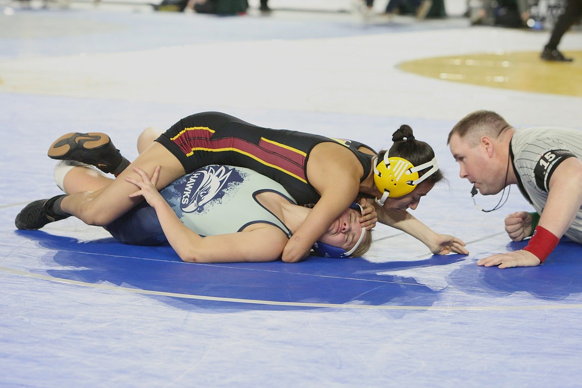 Ashley Naranjo, top left, Moses Lake, works to pin River Ridge’s Maya Lindauer in the 110-pound semifinals.