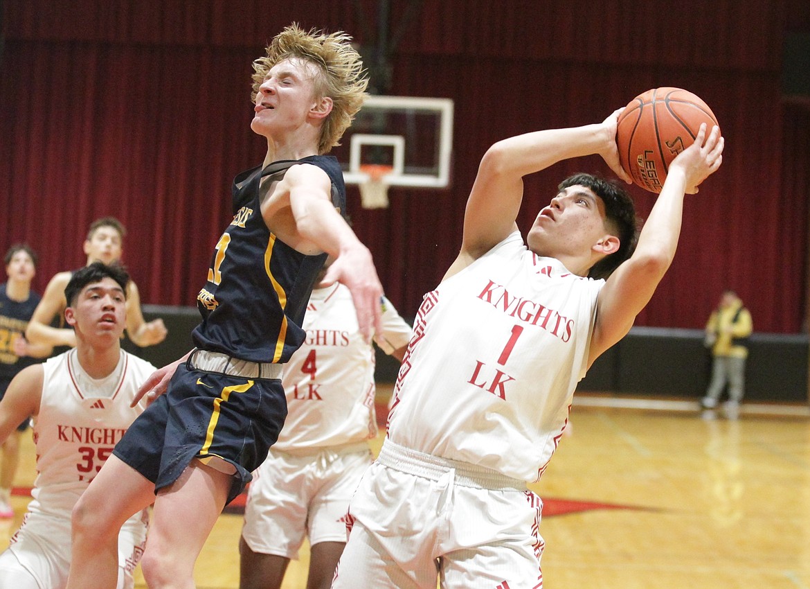 MARK NELKE/Press
Lakeside sophomore Hallah Peone (1) shoots as Genesis Prep sophomore Brady Rubert defends in the 1A Division I District 1 championship game Thursday at North Idaho College.