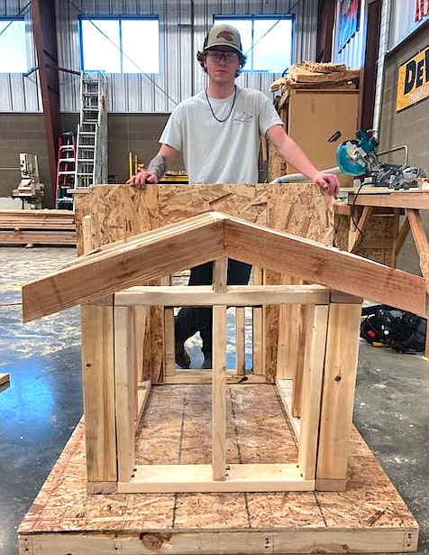 Lakeland High School student Colton Moore shows off the structure he built Thursday during a Skills USA competition at Kootenai Technical Education Campus. Eight seniors and six juniors in KTEC's construction program participated in the contest. Colton and two other students who aren't pictured, Arlen Holdahl, Lakeland and Dawson Spindler, Lake City High, were each awarded a new skill saw.