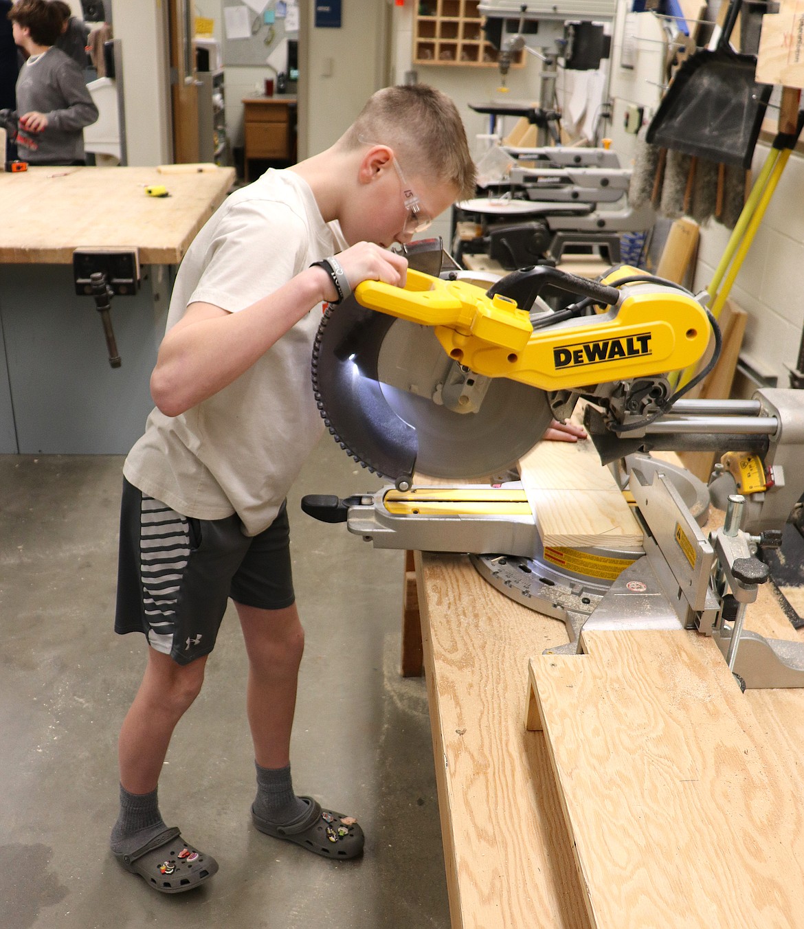 River City Middle School seventh grader Reese Reardon works with a miter saw that was purchased with grant funds raised at the Post Falls Education Foundation's Wine, Stein and Dine event. This year's Wine, Stein and Dine is Saturday.