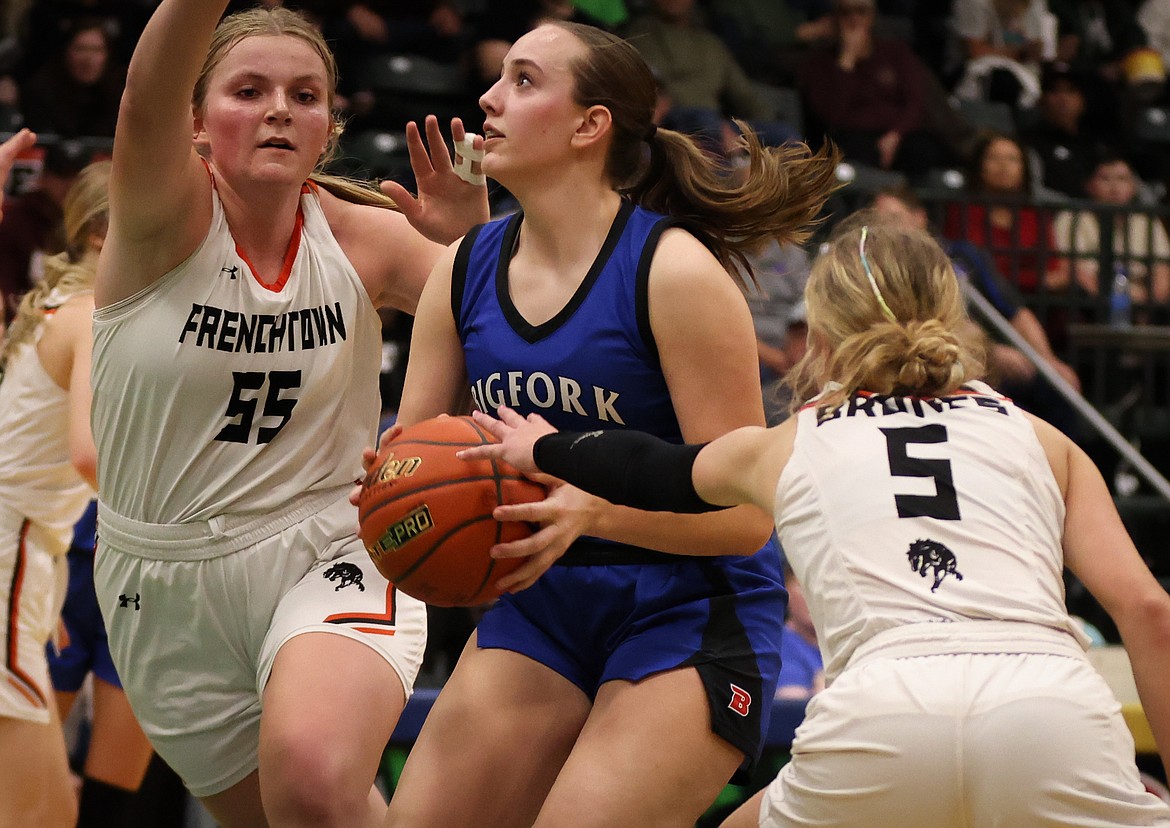 BIGFORK'S CALLIE GEMBALA is flanked by two Frenchtown defenders during the Western A Divisional girls championship Saturday. The Valkyries beat the Broncs 41-29. (Jeremy Weber/Bigfork Eagle)
