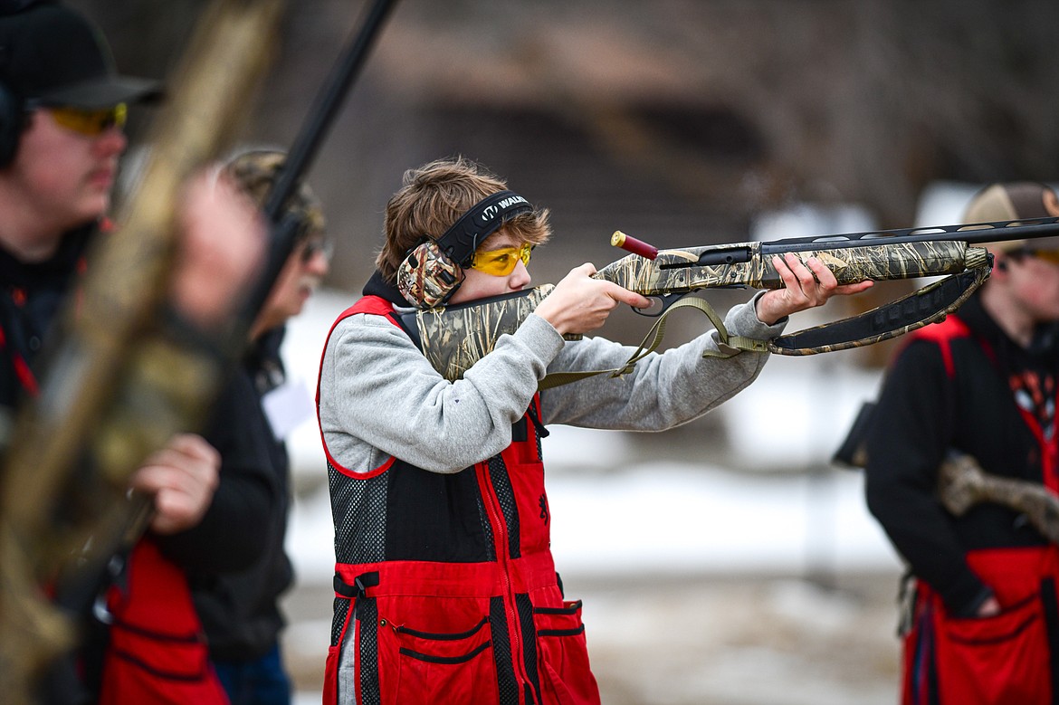 Chase DePoe, of the Wad Squad, fires at a clay target during a round of doubles in the Pheasants Forever Youth Shooting League at the Flathead Valley Target Club on Saturday, Feb. 24. (Casey Kreider/Daily Inter Lake)
