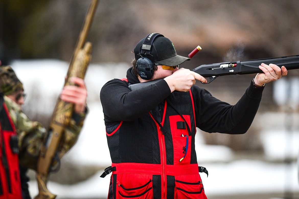 Clint Liem, of the Wad Squad, fires at a clay target during a round of doubles in the Pheasants Forever Youth Shooting League at the Flathead Valley Target Club on Saturday, Feb. 24. (Casey Kreider/Daily Inter Lake)