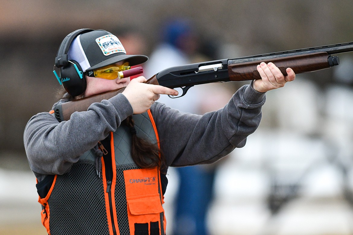 Braidy Billington, of the Clay Commanders, fires at a clay during a round of doubles in the Pheasants Forever Youth Shooting League at the Flathead Valley Target Club on Saturday, Feb. 24. (Casey Kreider/Daily Inter Lake)