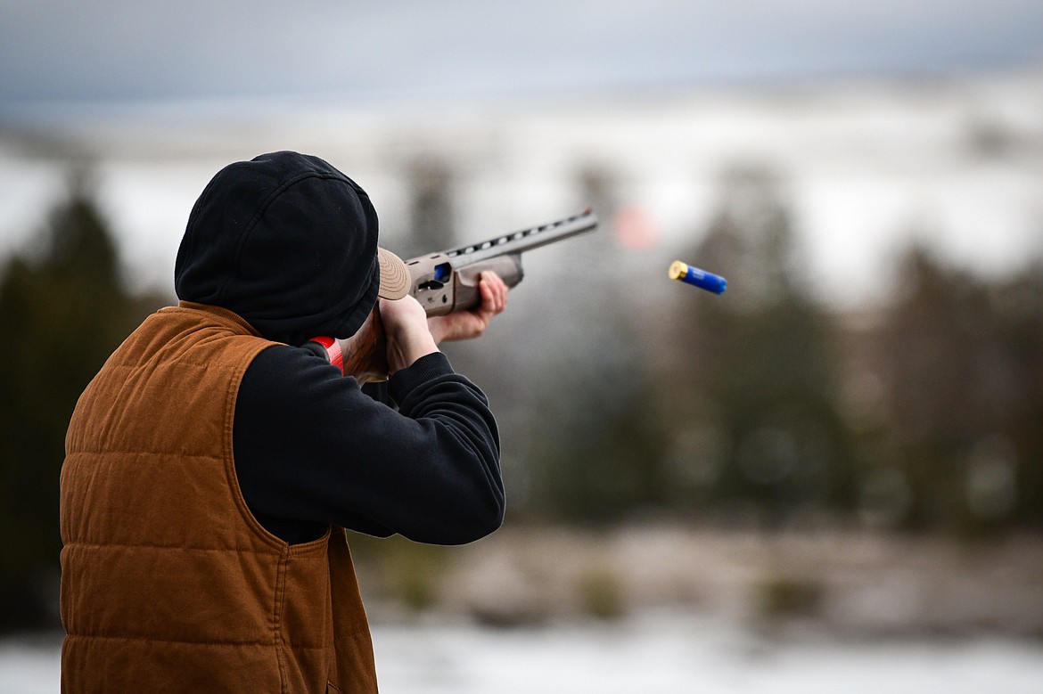 Logan Oswald, of the Wing Nuts, fires at a clay target during a round of doubles in the Pheasants Forever Youth Shooting League at the Flathead Valley Target Club on Saturday, Feb. 24. (Casey Kreider/Daily Inter Lake)