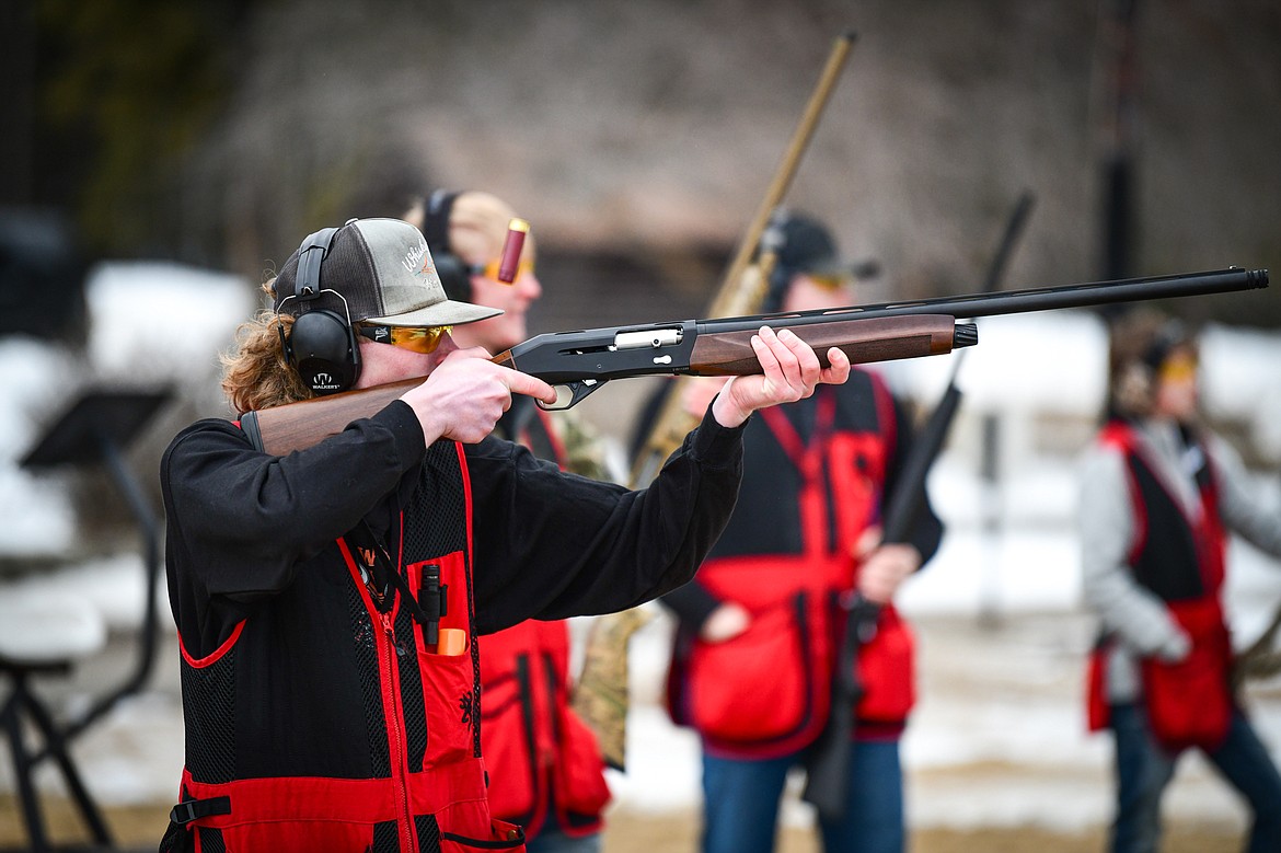 Michael Marrinan, of the Wad Squad, fires at a clay target during a round of doubles in the Pheasants Forever Youth Shooting League at the Flathead Valley Target Club on Saturday, Feb. 24. (Casey Kreider/Daily Inter Lake)