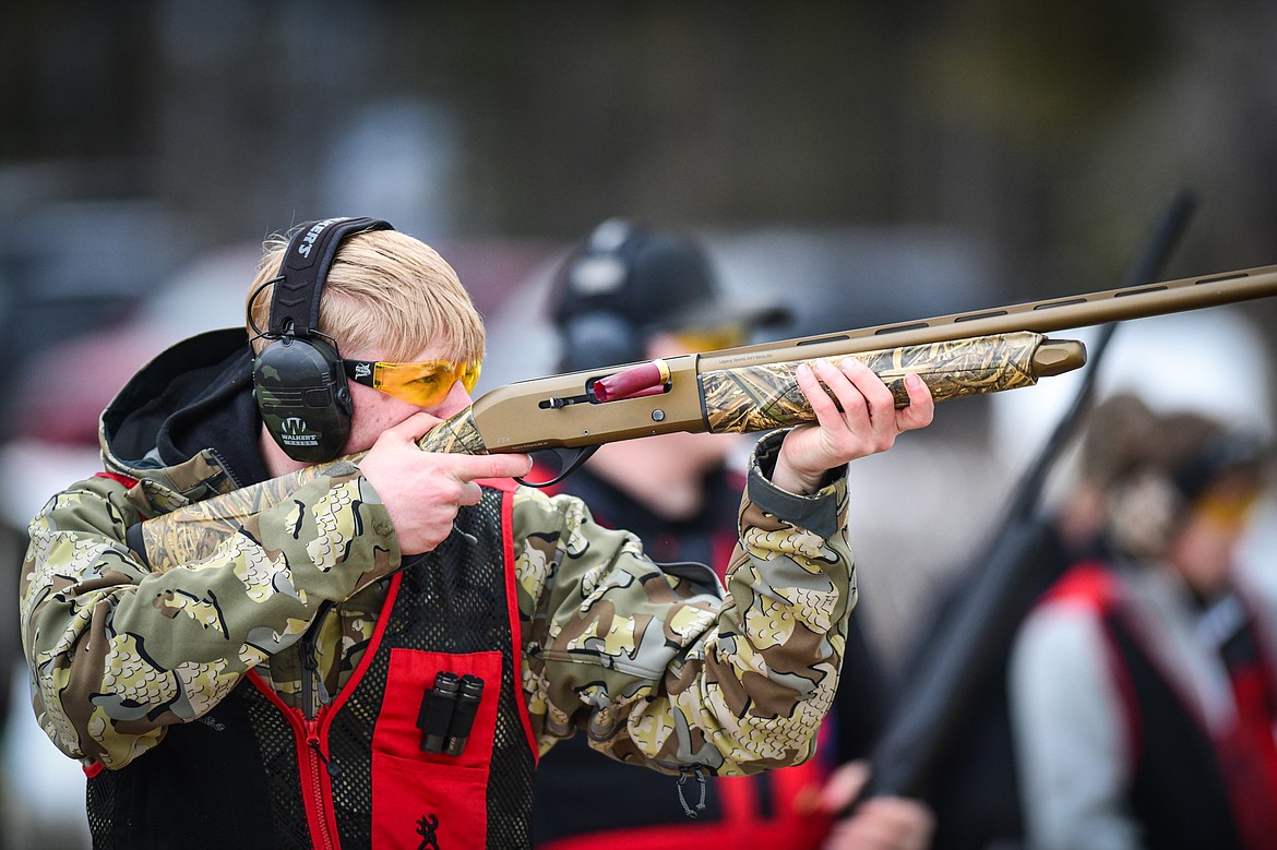 Quincy Styles, of the Wad Squad, fires at a clay target during a round of doubles in the Pheasants Forever Youth Shooting League at the Flathead Valley Target Club on Saturday, Feb. 24. (Casey Kreider/Daily Inter Lake)