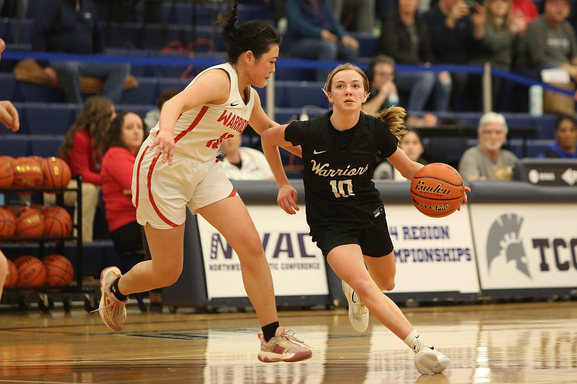 Almira/Coulee-Hartline sophomore Naomi Molitor (10) dribbles toward the rim in Saturday’s regional game against Crosspoint.