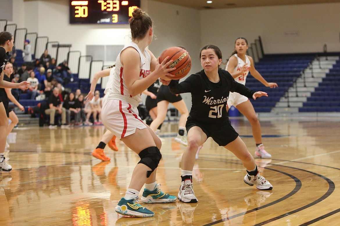 Almira/Coulee-Hartline senior Beth Okamoto (20) defends a Crosspoint player in the third quarter.