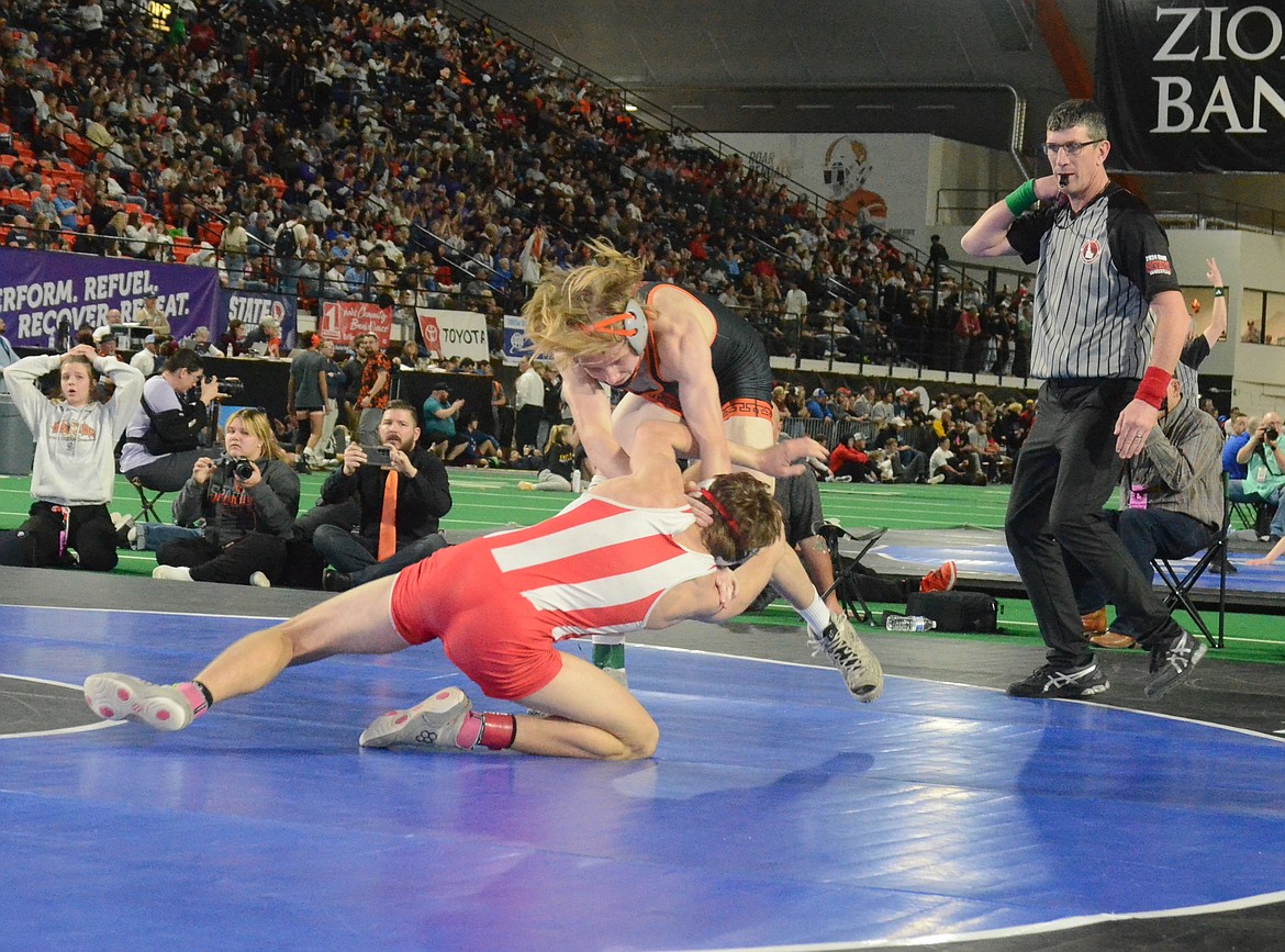 Photos by NORM, DAN and KELLY SEE
Priest River junior Colm McLaimtaig, top, battles Jack Eddins of Grace in the 2A 138-pound title match at the state wrestling championships Saturday at the ICCU Dome in Pocatello.