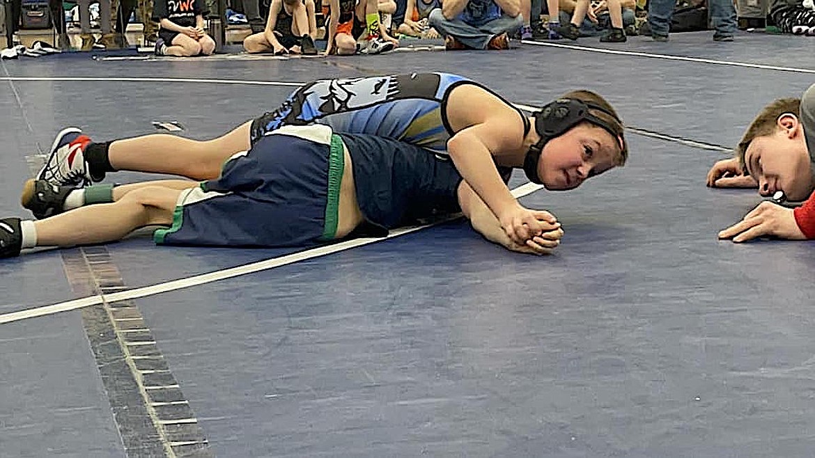 A Libby Wrestling Club member seeks a pin at the Making a Difference tournament in Kalispell. (Photo courtesy Greenchain Wrestling Club)