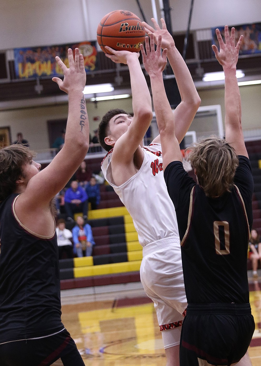 Arlee's Ben Old Person-Harlow goes up for two points against Florence in last week's Divisional tourney. (Bob Gunderson photo)