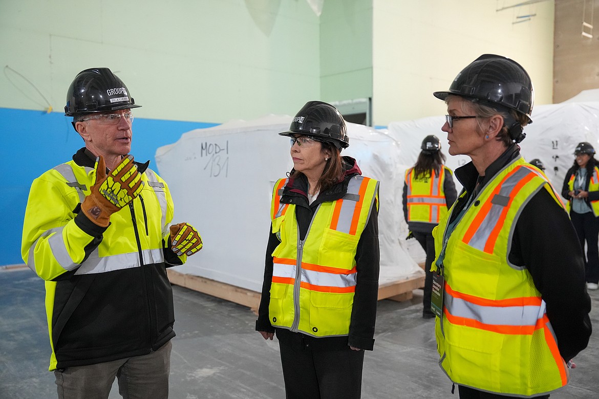 Group14 CEO Rick Luebbe, right, talks with Sen. Maria Cantwell, D-Washington, and U.S. Energy Secretary Jennifer Granholm on a tour of Group14’s facility Thursday.