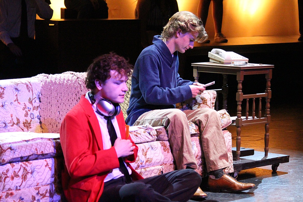 Christopher (Noah Carlile), foreground, and his dad have a difficult conversation in the Moses Lake High School production of “The Curious Incident of the Dog in the Night-time.”