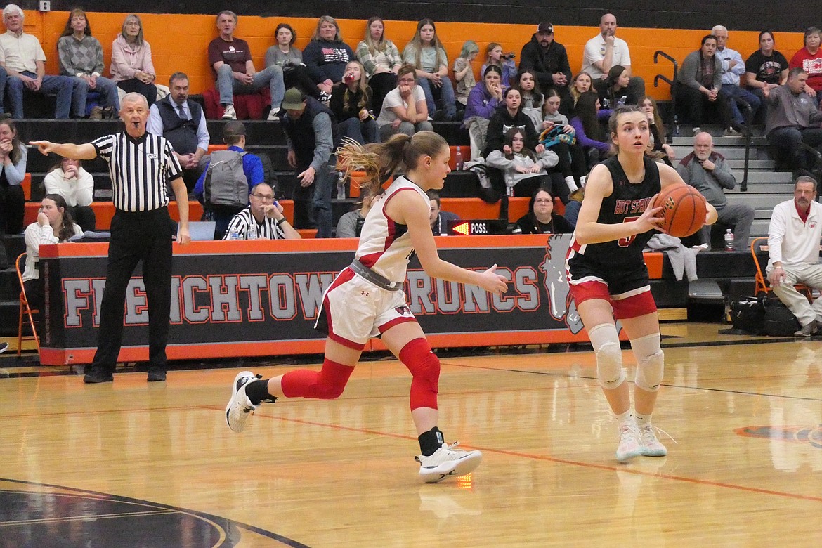 Hot Springs sophomore Kara Christensen looks for a passing lane during the Lady Heat's Western Divisional C playoff game Thursday in Frenchtown.  (Chuck Bandel/VP-MI)