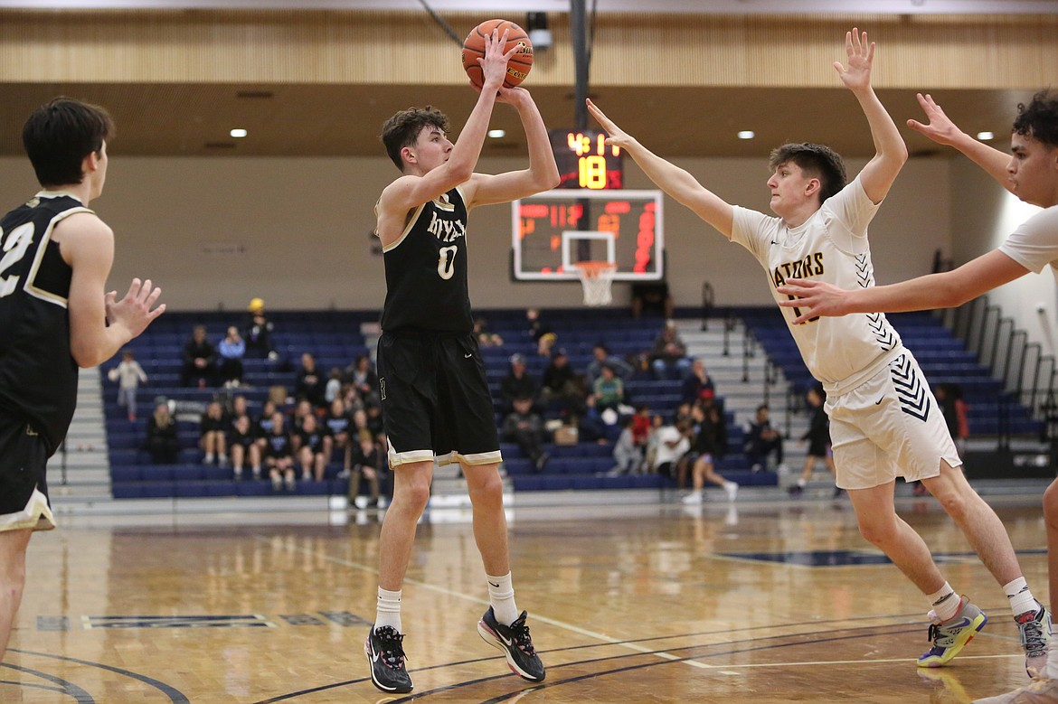 Royal freshman Grant Wardenaar (0) led the Knights with 14 points in their regional game against No. 3 Annie Wright Saturday at Tacoma Community College.