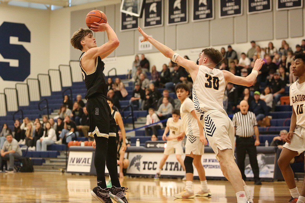 Royal senior Caden Allred, left, shoots a fadeaway jump shot in the second quarter against Annie Wright at Tacoma Community College.