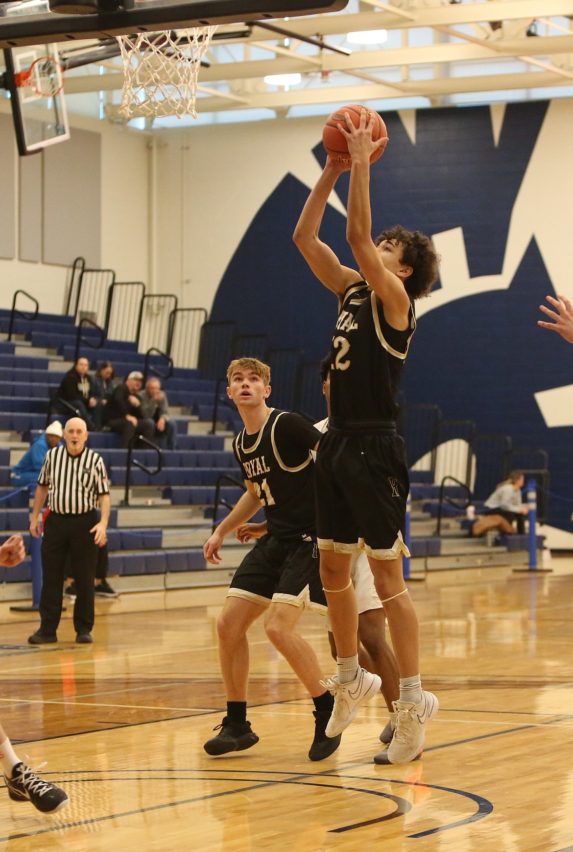 Royal junior James Blair, foreground, attempts an open layup in the first quarter against Annie Wright.