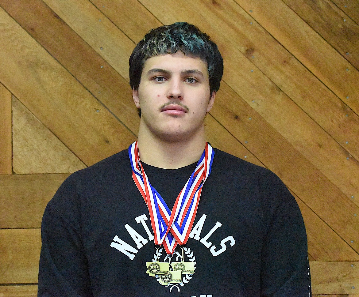 Libby Greenchain wrestler Jace DeShazer displays the three gold medals he won from 2022 to 2024 at the Montana High School Association Class A championships. (Scott Shindledecker/The Western News)