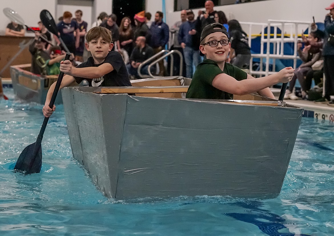 Seventh graders Crew V Walther (front) and Parker A Sozzoni (back) row across the pool at SafeSplash, competing to try and make the fastest time.