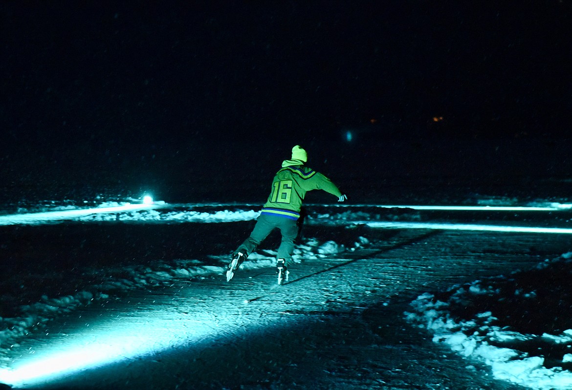 Gabriel Layton skates on an ice trail he created at City Beach in Whitefish on Feb. 18, 2024. (Matt Baldwin/Whitefish Pilot)