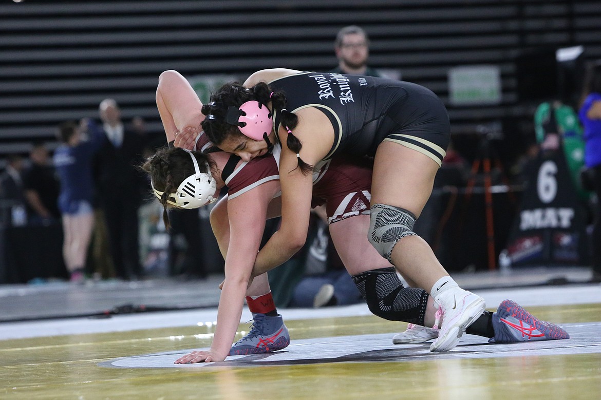 Royal senior Emma Villa, right, placed in the top three of the Mat Classic all three years she qualified for the state tournament.