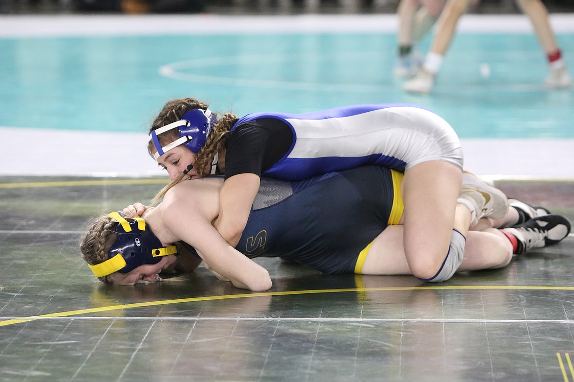 Warden senior Jada Hernandez, top, defeated Forks’s Miley Blanton to reach the state finals match.