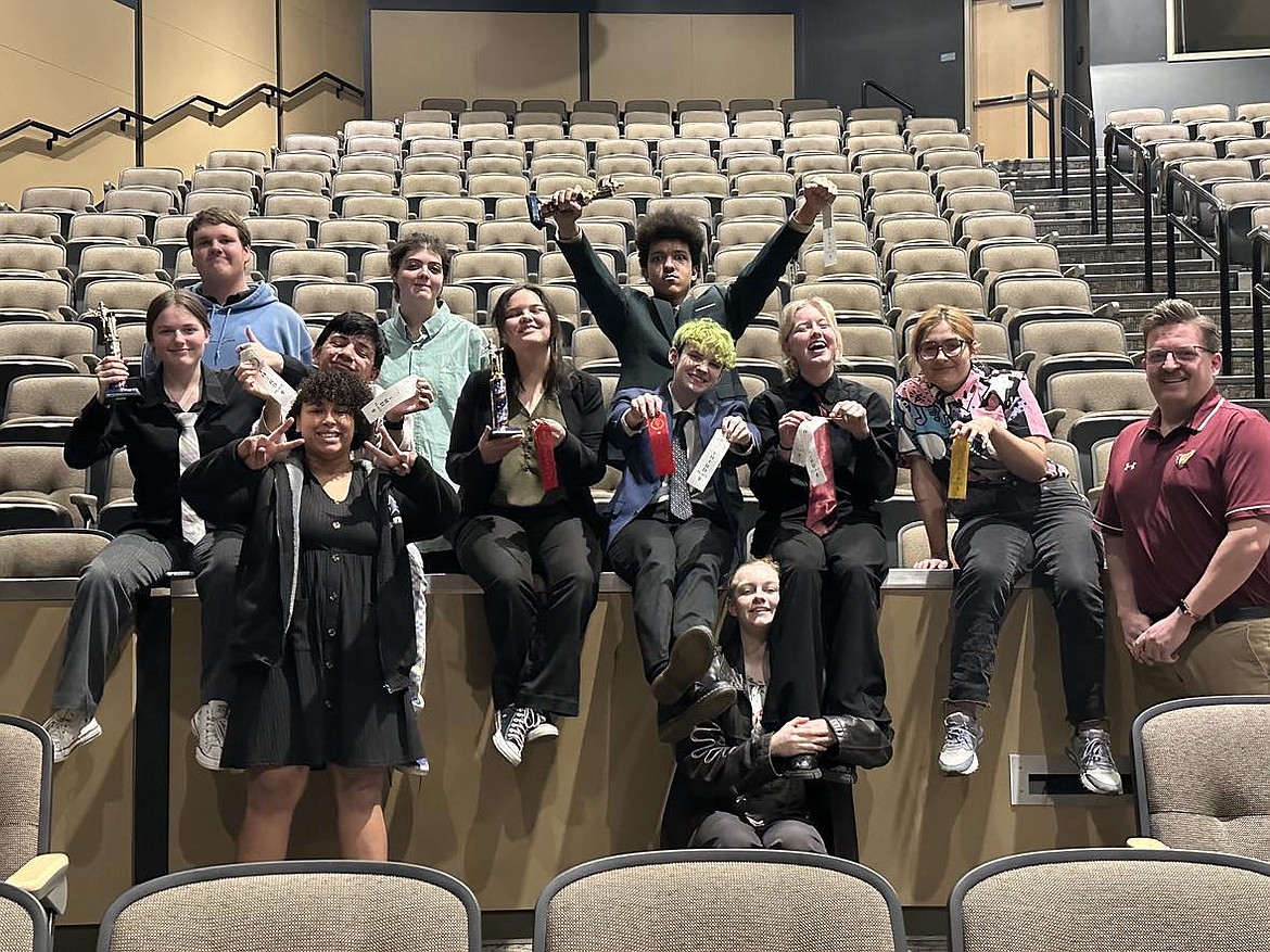 The Moses Lake High School speech and debate team, many of them rookies, display the awards won in competition.