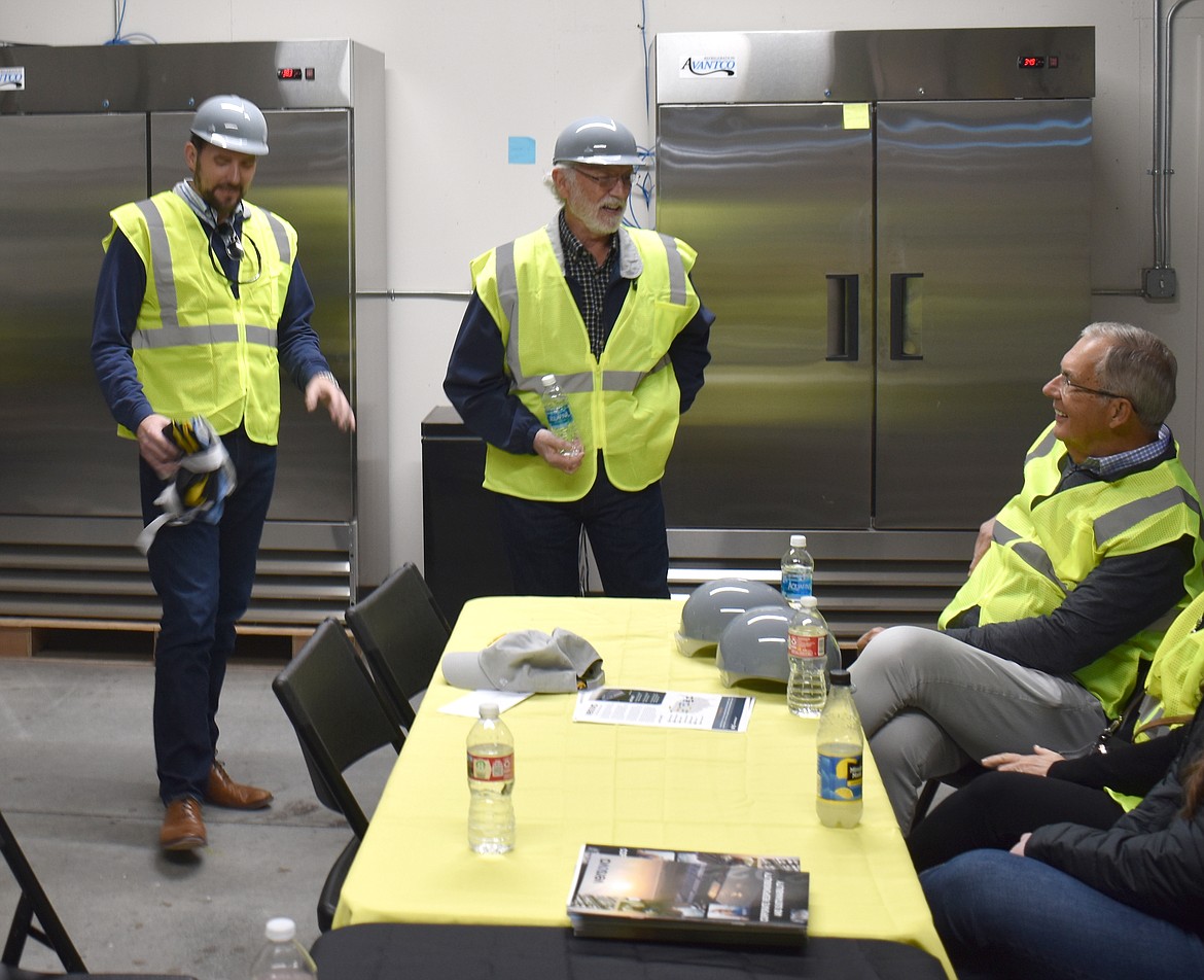 U.S. Rep. Dan Newhouse talks with Versoval Chief Financial Officer Matthew Dean, left, and Chief Executive Officer Jim Dean at Willamette Egg Farms’ Moses Lake facility Tuesday.