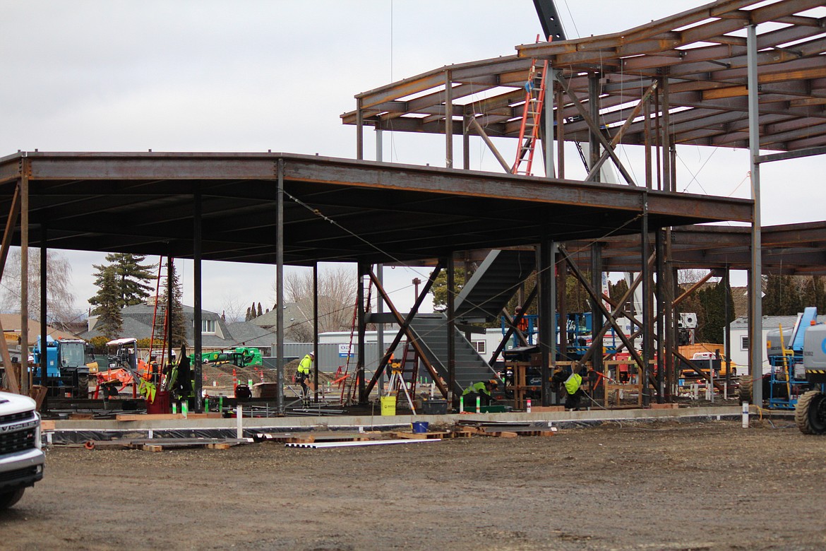 Construction crews raise the steel supports at the new Quincy Valley Medical Center last week.