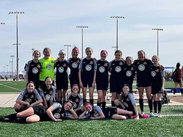 Photo by KARI HYNES
The Thorns North FC 11 Girls Academy soccer team finished second this past weekend at the Las Vegas Mayor's Cup. The girls started the tournament with a draw (1-1) against Colorado EDGE United 2011. The Thorns' goal came from Kylie Lorona on an assist from Olivia Hynes.   Later on Saturday the girls beat the Phoenix Rising Desert Foothills 12 Pre-ENCL 3-0. Kylie Lorona, Ava Langer and Mackenzie Dolan all scored and keepers Constance Ovendale and Mackenzie Dolan teamed for the shutout.  On Sunday morning the Thorns North FC defeated La Roca FC 12G 4-0 in the semifinals. Kylie Lorona scored two goals, while teammates Olivia Nusser and Mackenzie Dolan each scored one. In the finals, the Thorns lost 1-0 to the Heat FC G12 Pre-ECNL. In the front row from left are Olivia Nusser and Mackenzie Dolan; second row from left, Ella Linder, Presley Moreau, Brightyn Gatten and Aubrey Sargent; and back row from left, Payton Brennan, Constance Overndale, Kylie Lorona, Vivian Hartzell, Zoe Lemmon, Emily Hackett, Ava Langer, Avery Thompson, Millie Meyer and Olivia Hynes.