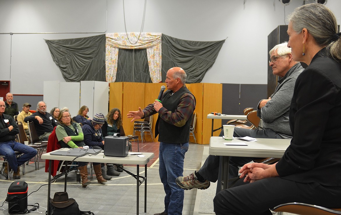 Brian Lipscomb, CEO of Energy Keepers, addresses a crowd at a recent energy forum in Paradise, alongside Nobel Prize-winning climate scientist Steve Running and Missoula attorney and U.S. House candidate Monica Tranel. (Kristi Niemeyer/Leader)