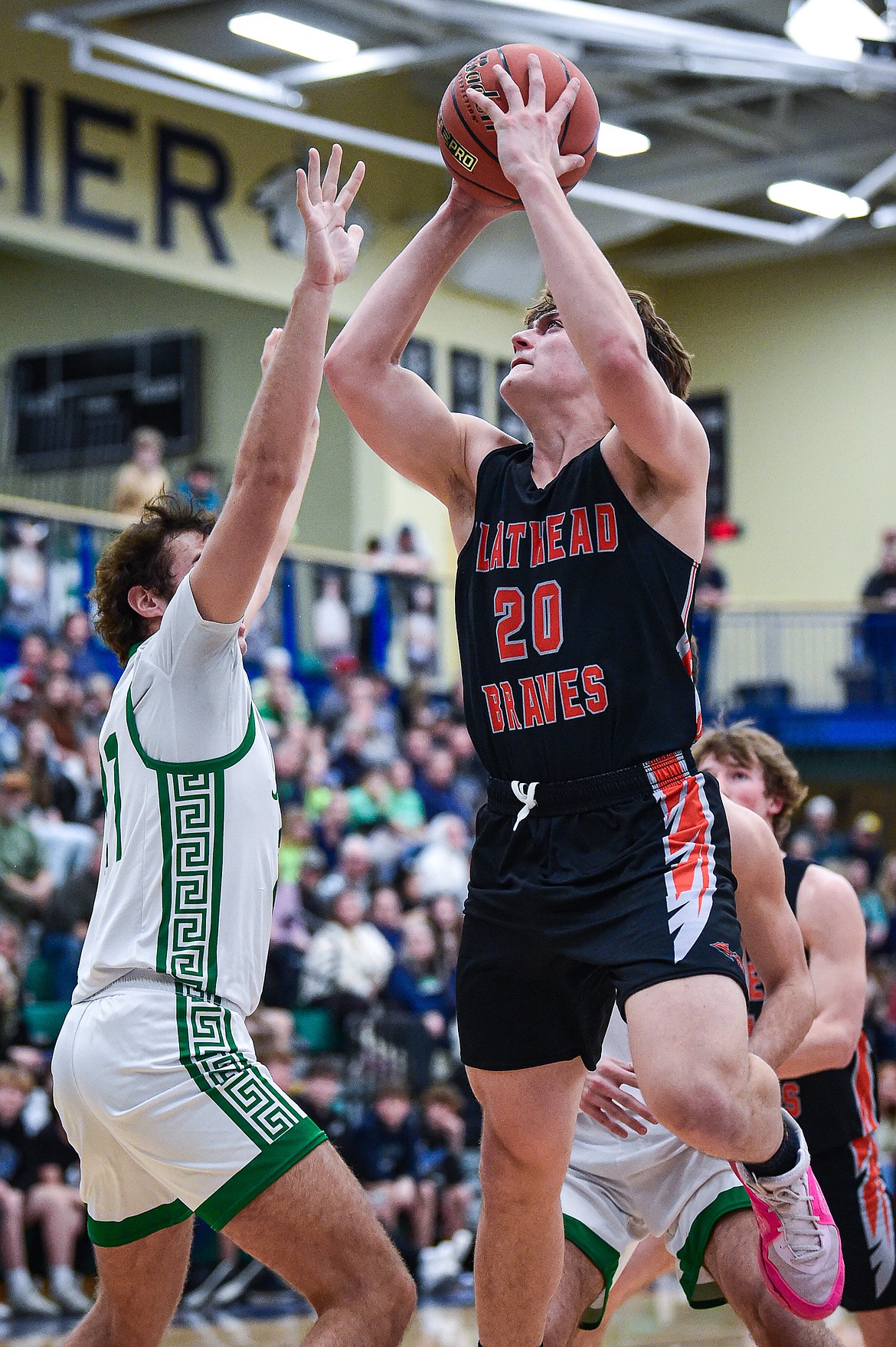 FLATHEAD FORWARD Gabe Sims goes up for two against Glacier in the Crosstown boys basketball game on Feb. 1. The three-sport athlete is averaging 5.3 points and 4.4 rebounds for the Braves. (Casey Kreider/Daily Inter Lake)