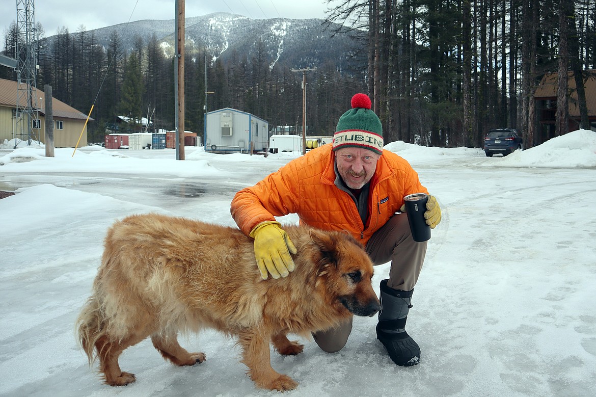 Greg “Gumby” Garcelon and his dog Jake in Essex on Friday, Feb. 23. (Carl Foster/Daily Inter Lake)