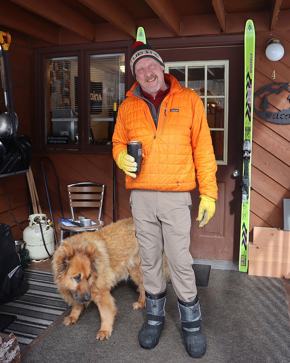 Greg “Gumby” Garcelon and his dog Jake in Essex on Friday, Feb. 23. (Carl Foster/Daily Inter Lake)