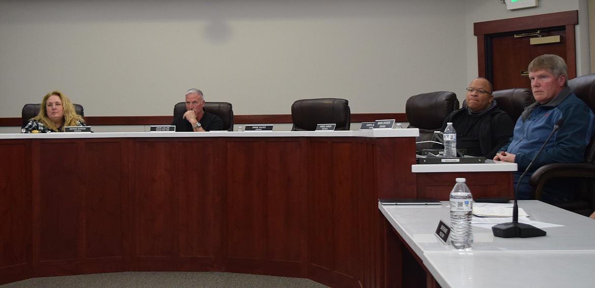 Othello City Council members, from left to right, Genna Dorow, John Lallas, Darryl Barnes and Mark Snyder listen to a presentation during Monday’s regular meeting at Othello City Hall. The meeting featured a discussion of approving the sale of surplus Public Works Department equipment.